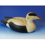 A CARVED AND PAINTED DUCK DECOY, STAMPED MIKE WOOD ON THE BASE. L. 44cms.