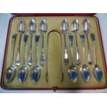 A CASED SET OF TWELVE HALLMARKED SILVER TEA SPOONS WITH SUGAR TONGS.