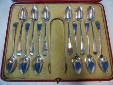 A CASED SET OF TWELVE HALLMARKED SILVER TEA SPOONS WITH SUGAR TONGS.