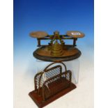 AN EDWARDIAN SET OF BRASS POSTAGE SCALES WITH WEIGHTS, TOGETHER WITH A LETTER RACK OF THE SAME