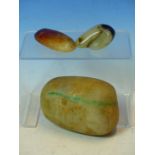 AN ANTIQUE NATURAL FORM JADE BOULDER 12CM WIDE TOGETHER WITH TWO SMALLER POLISHED JADE EXAMPLES (3)