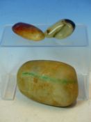 AN ANTIQUE NATURAL FORM JADE BOULDER 12CM WIDE TOGETHER WITH TWO SMALLER POLISHED JADE EXAMPLES (3)