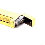 A DUNHILL GOLD PLATED ROLLAGAS CIGARETTE LIGHTER