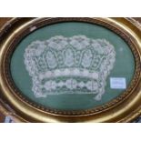 AN ANTIQUE WHITE LACEWORK CRAVAT WITH FLOWER AND FRUIT DECORATION NOW FRAMED TOGETHER WITH AN OVAL