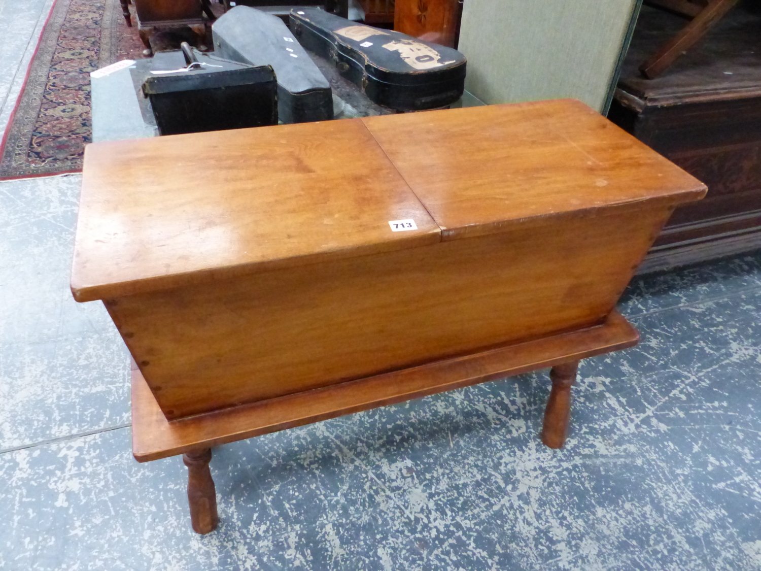 AN AMERICAN MAPLE HINGED TOP WORK BOX ON TURNED LEG STAND. H. 62 x W. 82cms.