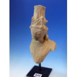 AN ANTIQUE FAR EASTERN CARVED STONE BUST FRAGMENT OF A DEITY LATER MOUNTED ON DISPLAY SATND. THE