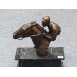 A BRONZE OF JOCKEY AND HORSE ON MARBLE PLINTH.