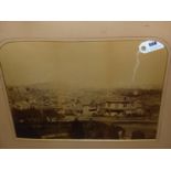 A LARGE VINTAGE PHOTOGRAPH OF A COLONIAL PORT, POSSIBLY AMERICAN. SHAPED MOUNT, UNFRAMED. 39 x