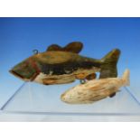 TWO ANTIQUE CARVED WOOD AND WEIGHTED FISHING LURES TOGTHER WITH A WORKED BONE IMPLEMENT.