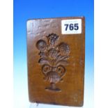 AN ANTIQUE CARVED WOOD DOUBLE SIDED MOULD.15 CM WIDE