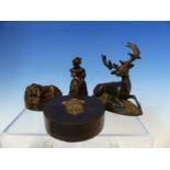 A BRONZE PAPERWEIGHT IN THE FORM OF A STAG , ANOTHER OF A SLEEPING LION, A BRONZE FIGUARAL CANDLE