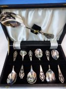 A CASED SET OF HALLMARKED SILVER DESSERT SPOONS AND SERVER.