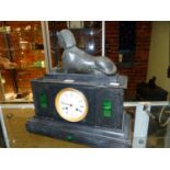 A LATE VICTORIAN SLATE EGYPTIAN REVIVAL MANTEL CLOCK, A SPHINX ABOVE ENAMEL DIAL WITH FLANKING