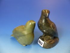 TWO INUIT CARVED LIMESTONE FIGURES OF BIRDS. ONE WITH INSCRIBED BASE, THE OTHER WITH OLD LABEL.