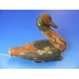 AN ANCIENT EGYPTIAN CARVED AND POLYCHROMED WOODEN FIGURE OF A DUCK. H. 18cms.
