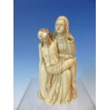 AN 18TH CENTURY CARVED IVORY FIGURE GROUP OF THE VIRGIN HOLDING THE DEAD CHRIST. PROBABLY GERMAN. 12