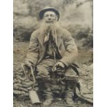A VINTAGE PORTRAIT PHOTOGRAPH OF "BRUSHER MILLS", BRITAIN'S LAST PROFESSIONAL SNAKE CATCHER, A