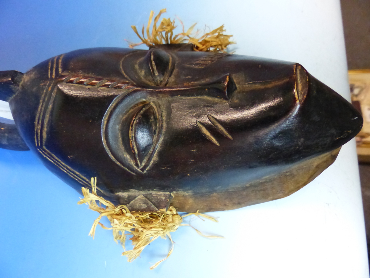 TWO CARVED AND DECORATED DECORATIVE AFRICAN TRIBAL MASKS. HEIGHT OF LARGEST 53cms. - Image 10 of 15