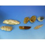 A COLLECTION OF EARLY KNAPPED FLINT TOOLS, SPEAR AND ARROW HEADS TOGTHER WITH TWO TRILOBITE FOSSILS