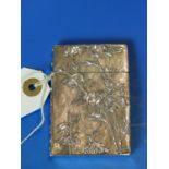 A CHINESE SILVER FLORAL AND FOLIATE DECORATED CARD CASE. H. 8cms. TOGETHER WITH A MOTHER OF PEARL