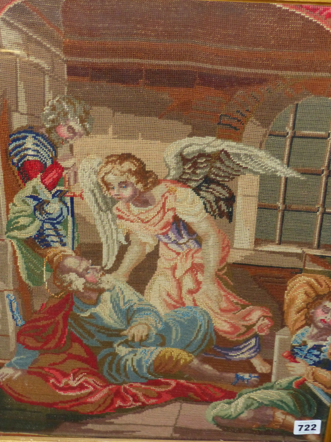 A VICTORIAN NEEDLEPOINT PANEL OF AN ANGEL AND OTHER FIGURES WITHIN AN ARCHITECTURAL SETTING. 54 x