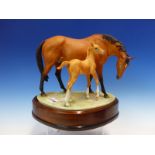 A 1970 ROYAL WORCESTER GROUP OF PRINCESS GRACE & FOAL MODELLED BY DORIS LINDNER. W 26cms.