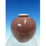 A CHINESE PEACH BLOOM SPHERICAL VASE, THE GLAZE OF AN EVEN COLOUR BELOW THE WHITE RIM, SIX CHARACTER