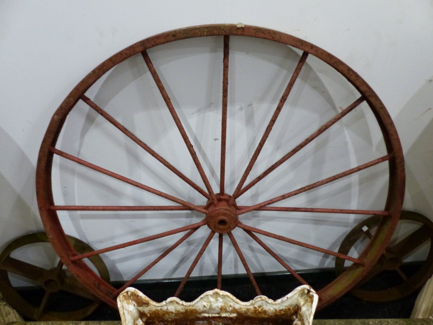 A PAIR OF LARGE IRON CARTWHEELS AND FOUR SMALLER IRON RAIL WHEELS. - Image 2 of 2