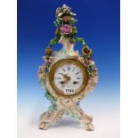 A MEISSEN PORCELAIN FLORAL ENCRUSTED ROCOCO CLOCK CASE ON FOUR LEGS, THE JAPY FRERES MOVEMENT