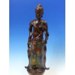 A CHINESE CHAMPLEVE ENAMELLED BRONZE FIGURE OF THE BUDDHA STANDING HOLDING A LOTUS FLOWER. H.41cms.