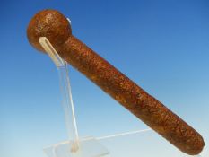 A MOTTLED BROWN HARDSTONE PESTLE WITH CYLINDRICAL HANDLE AND BALL HEAD. H 22.5cms.