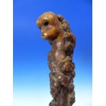 AN ORIENTAL CARVED ROOT WOOD WALKING STICK WITH MONKEY POMMEL TOGETHER WITH TWO OTHER CANES AND A
