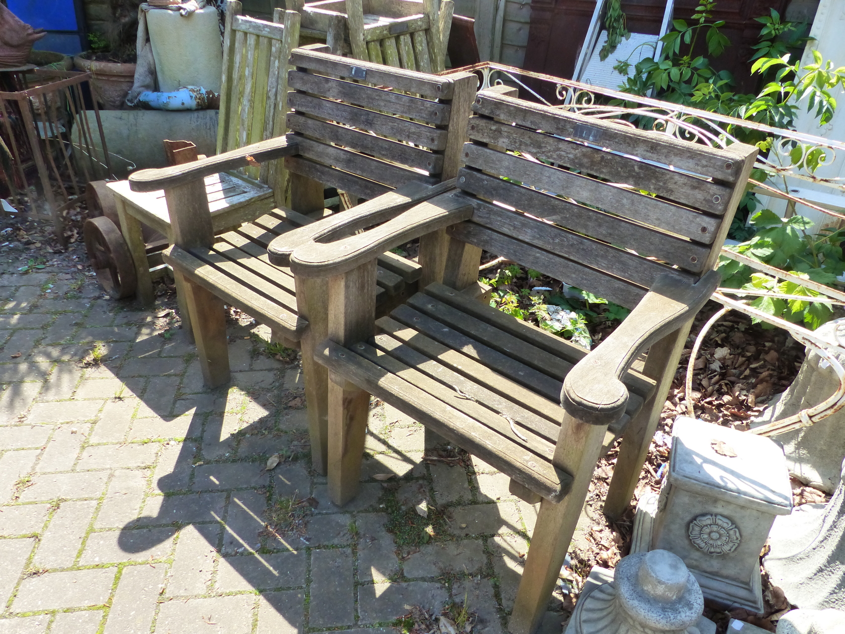 A LARGE OCTAGONAL TEAK GARDEN TABLE AND SIX CHAIRS TOGETHER WITH A SMALLER GARDEN TABLE. - Image 4 of 6