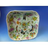 A CANTON PAINTED SQUARE DISH, BUTTERFLIES, FRUIT AND FLOWERS WITHIN THE GILT RIM. W 23.5cms.