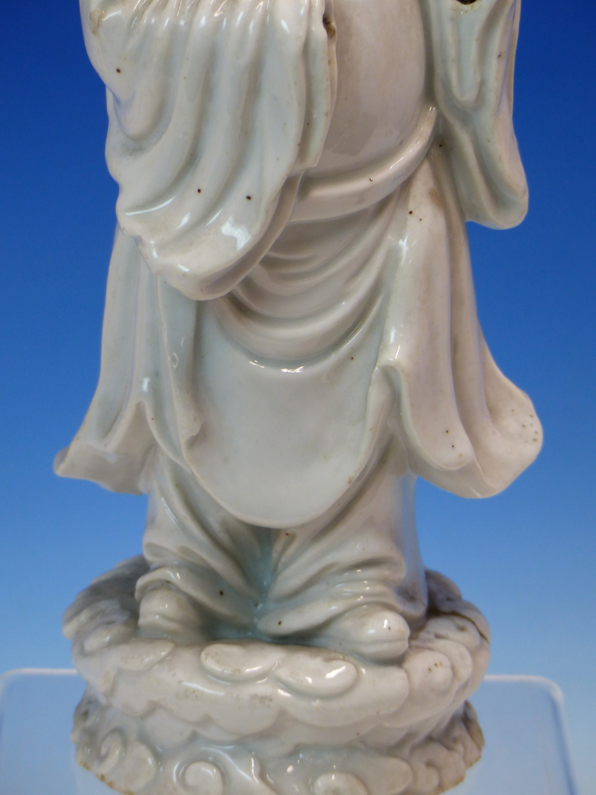 A BLANC DE CHINE FIGURE OF A FIERCE EYED MANDARIN STANDING ON A DOUBLE CLOUD PLINTH, HIS CHIN - Image 4 of 48