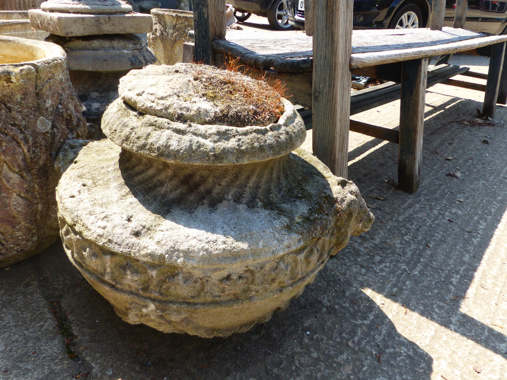 A SET OF FOUR CLASSICAL STYLE SWAG DECORATED COMPOSITE STONE GARDEN URNS, H 55cms. - Image 5 of 7