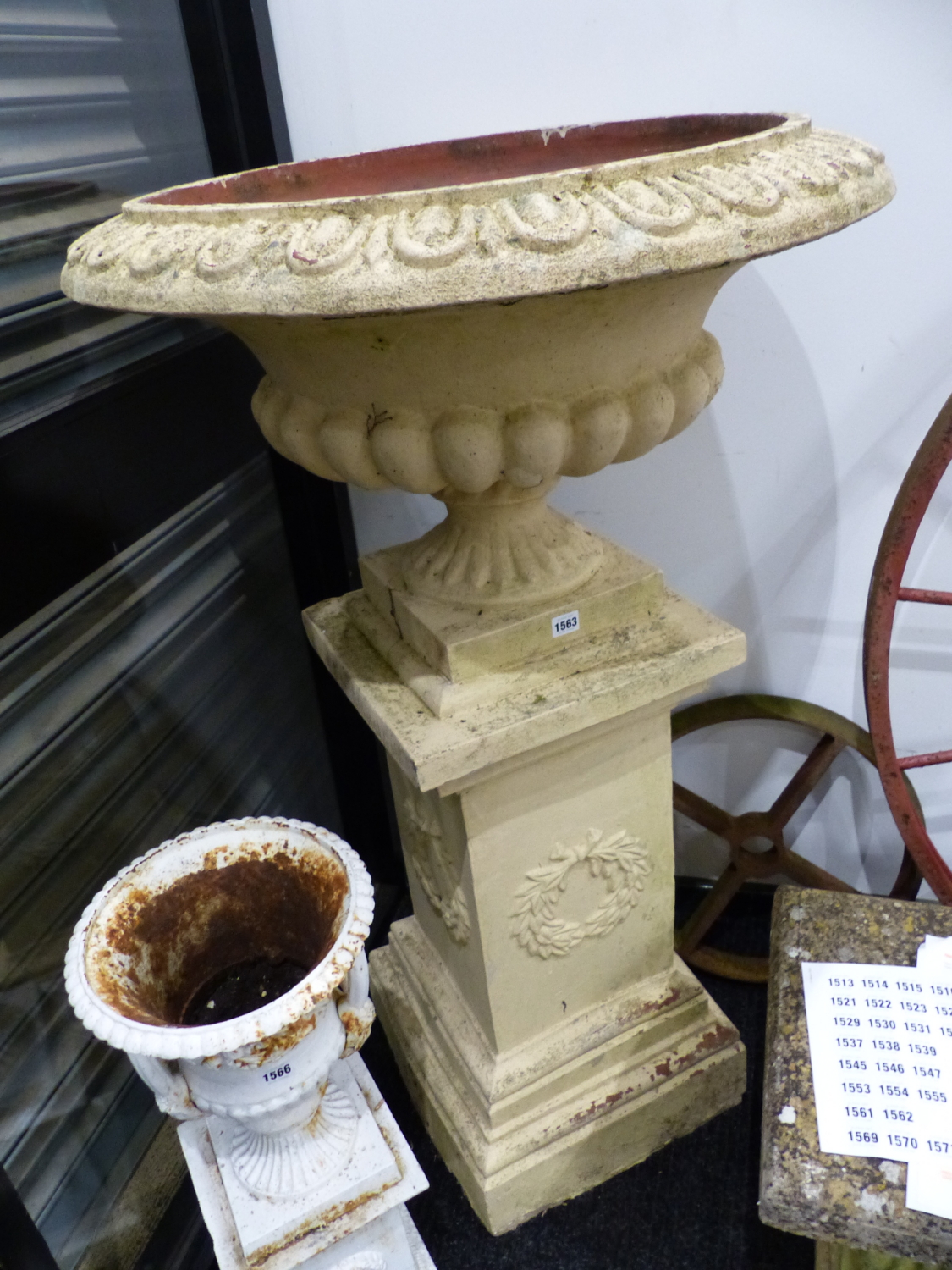 A SET OF FOUR PAINTED TERRACOTTA TERRACE URNS RAISED ON STEPPED SQUARE FORM PEDESTALS. Dia.73 x H.