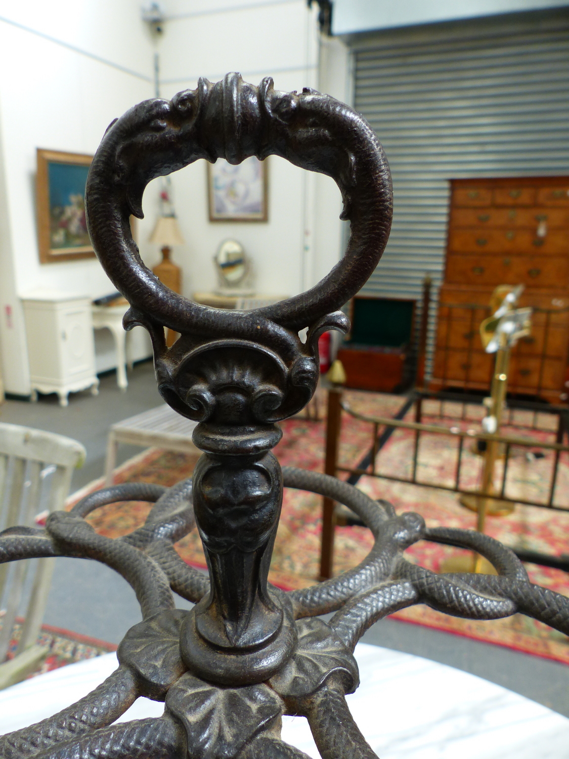 A CAST IRON STICK STAND, A RING HANDLE ABOVE SNAKES FORMING CIRCLES ABOVE THE CLUSTER COLUMN AND - Image 2 of 4