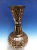 A QAJAR SILVER WIRE KOFTGARI STEEL VASE, THE WAISTED CYLINDRICAL NECK WITH LEAVES IN LAPPETS, THE