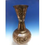 A QAJAR SILVER WIRE KOFTGARI STEEL VASE, THE WAISTED CYLINDRICAL NECK WITH LEAVES IN LAPPETS, THE