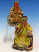 A CARVED AND PAINTED WOOD FIGURE OF TU DI GONG ENTHRONED WEARING A YELLOW ROBE HOLDING GOLD IN HID