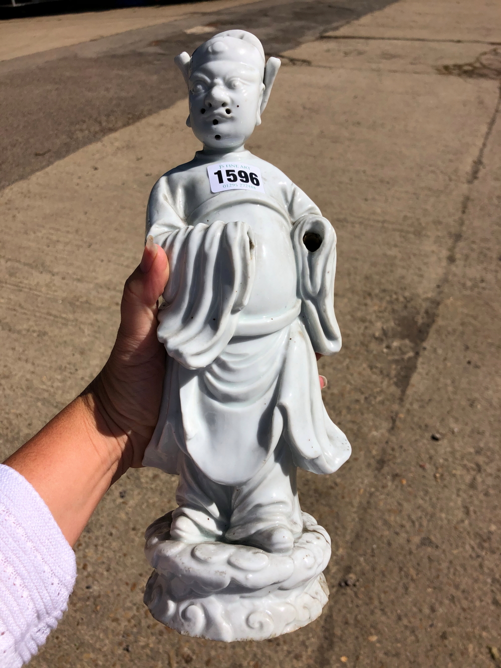 A BLANC DE CHINE FIGURE OF A FIERCE EYED MANDARIN STANDING ON A DOUBLE CLOUD PLINTH, HIS CHIN - Image 48 of 48