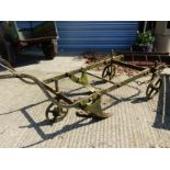 A LARGE ANTIQUE TWO FURROW PLOUGH.