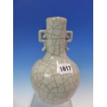 A CHINESE TWO HANDLED GREY GLAZED BOTTLE VASE CRACKLED IN TWO COLOURS. H 20cms.