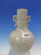 A CHINESE TWO HANDLED GREY GLAZED BOTTLE VASE CRACKLED IN TWO COLOURS. H 20cms.