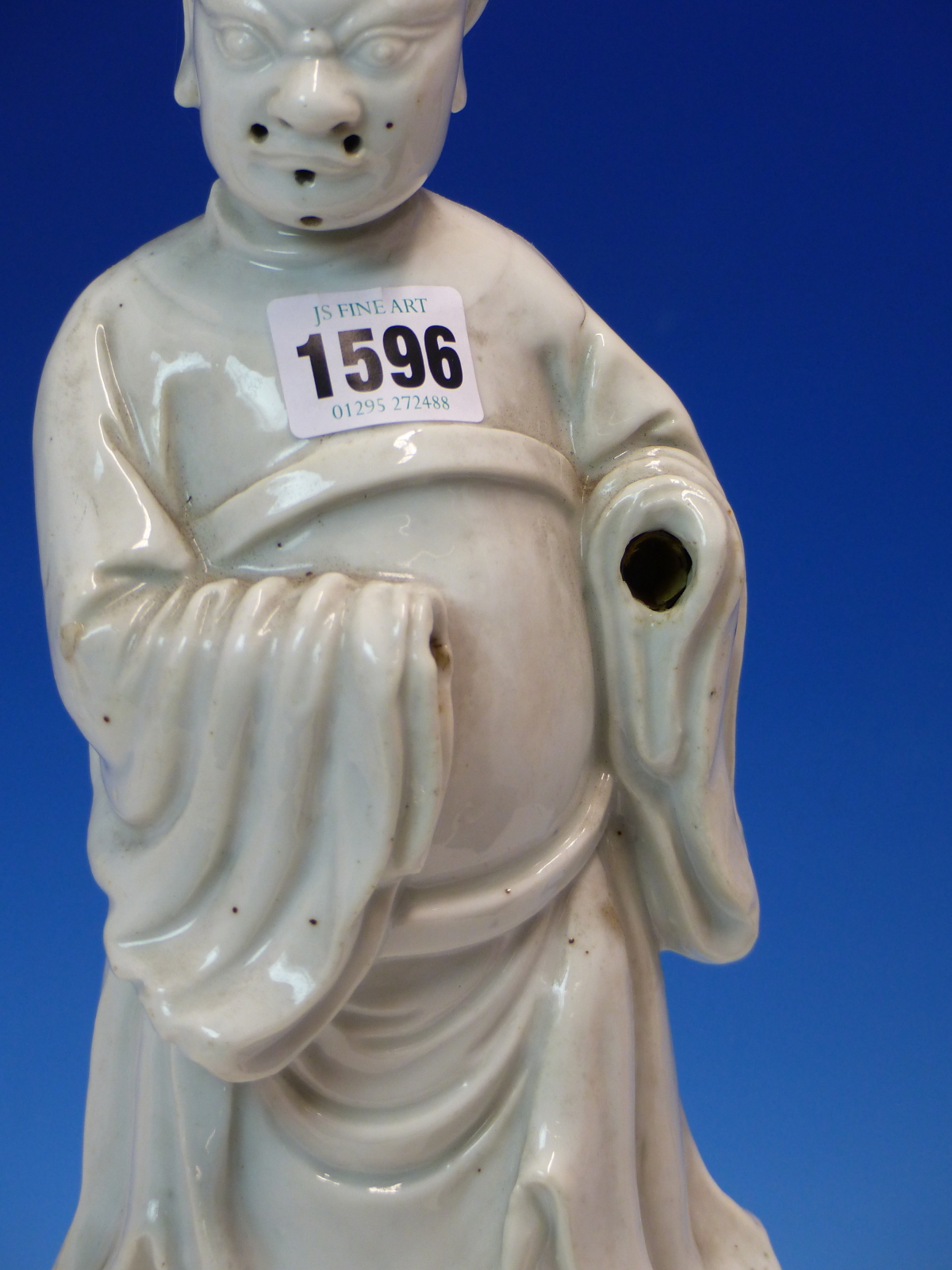 A BLANC DE CHINE FIGURE OF A FIERCE EYED MANDARIN STANDING ON A DOUBLE CLOUD PLINTH, HIS CHIN - Image 3 of 48