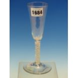 AN 18th C. ENGLISH OPAQUE TWIST ALE GLASS WITH SLENDER CONICAL BOWL AND ON CIRCULAR FOOT. H 17.