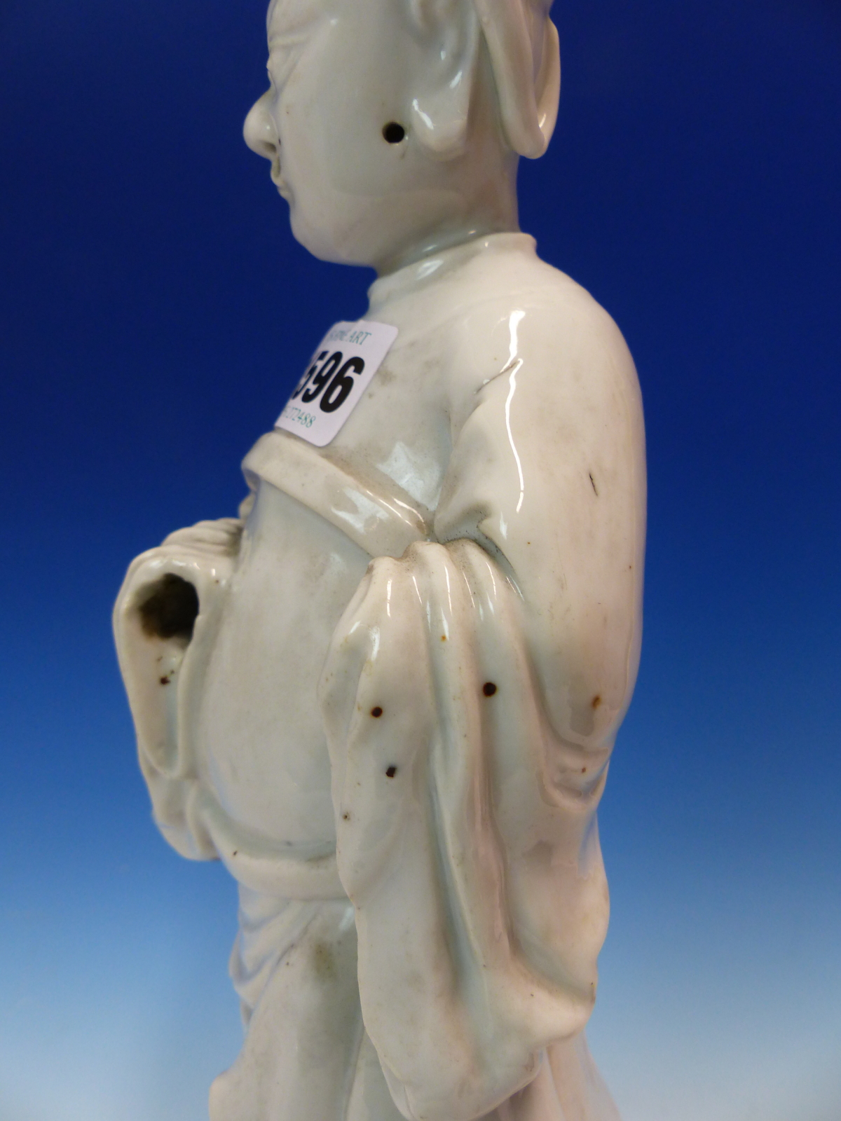 A BLANC DE CHINE FIGURE OF A FIERCE EYED MANDARIN STANDING ON A DOUBLE CLOUD PLINTH, HIS CHIN - Image 17 of 48