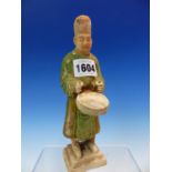 A TANG STYLE FIGURE OF A DRUMMER WEARING A BLACK HAT AND GREEN ROBE. H 19.5cms.