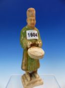 A TANG STYLE FIGURE OF A DRUMMER WEARING A BLACK HAT AND GREEN ROBE. H 19.5cms.